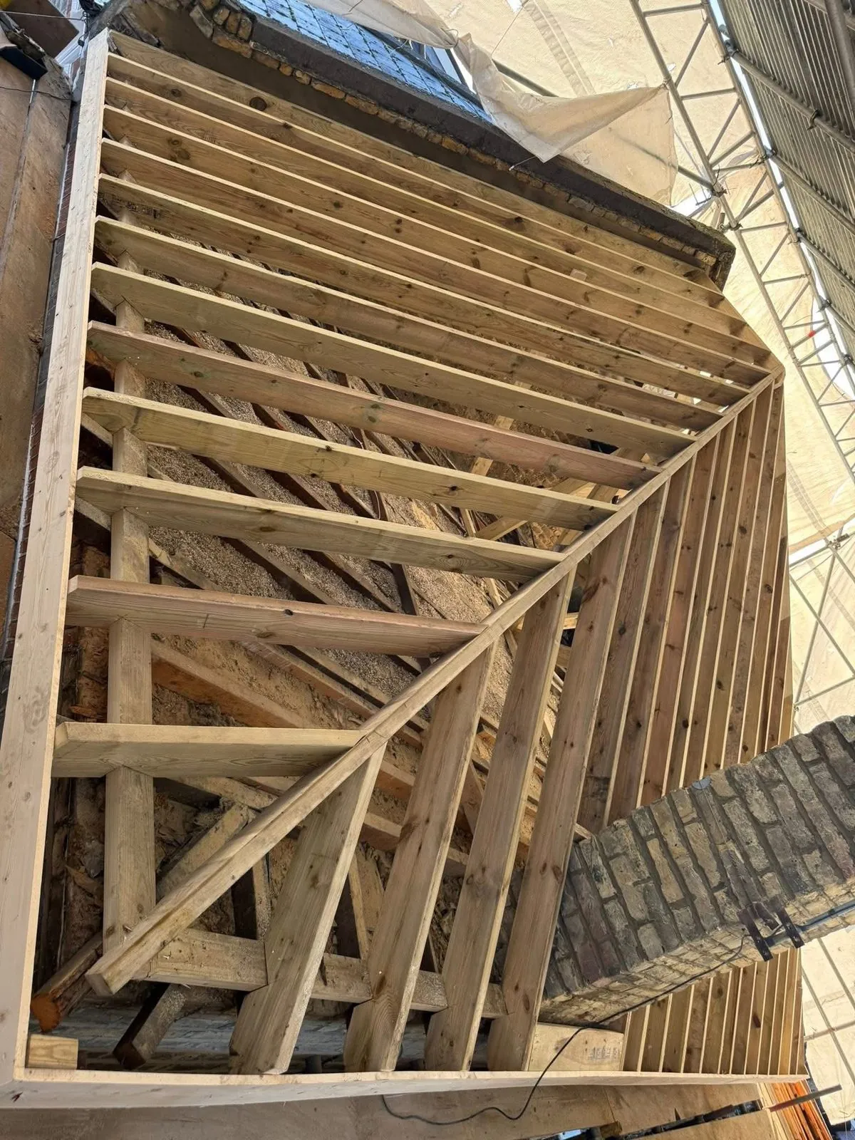 New roof timbers and rafters during a re-roof in Ottery St Mary